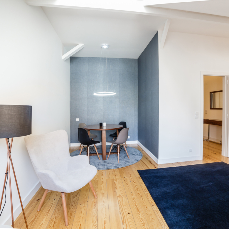 modern apartment with white walls and light wooden floor