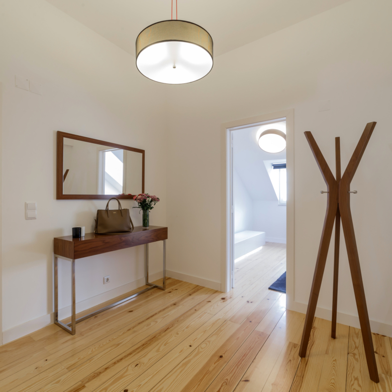 modern apartment with white walls and light wooden floor